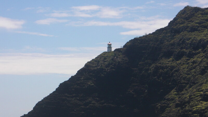 Lighthouse on Cliff — Blue, Serene, Afternoon, Photograph, Sky