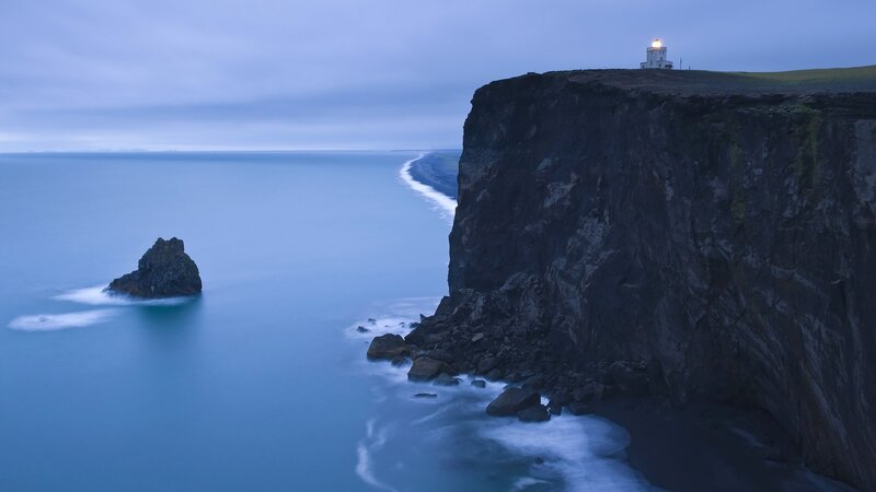 Lighthouse on Cliff — Blue, Serene, Night, Photograph, Ocean