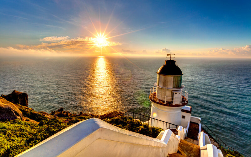 Lighthouse on Cliff — Blue, Serene, Sunset, Photograph, Ocean, Sun