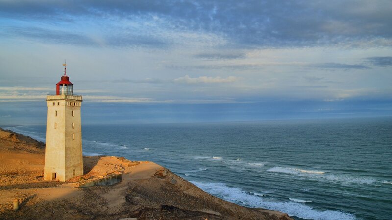 Lighthouse on Cliff — Blue, Serene, Sunset, Photograph, Ocean