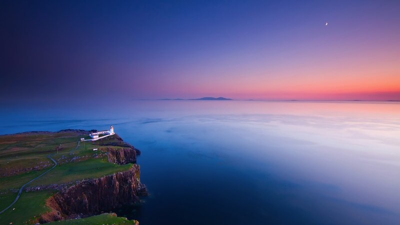 Lighthouse on Cliff — Blue, Serene, Sunset, Photograph, Sea