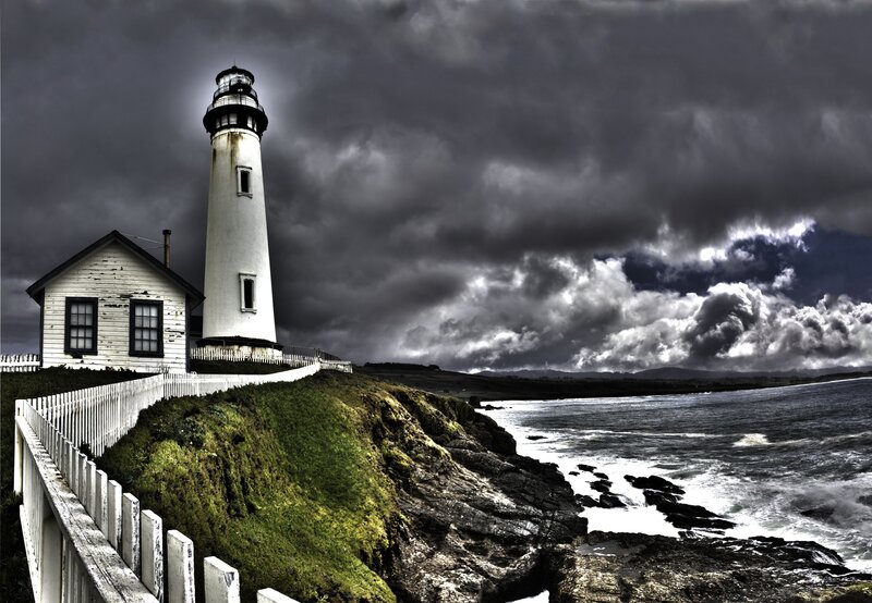 Lighthouse on Cliff — Gray, Dramatic, Photograph, Ocean, Clouds, Fence