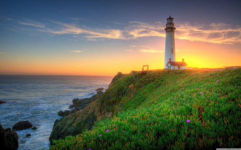 Lighthouse on Cliff — Green, Serene, Sunset, Photograph