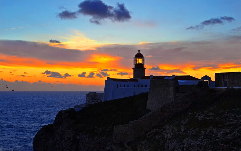 Lighthouse on Cliff — Orange, Dramatic, Sunset