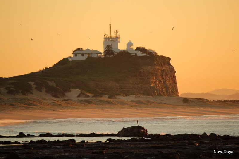 Lighthouse on Cliff — Orange, Serene, Sunset, Photograph, Beach