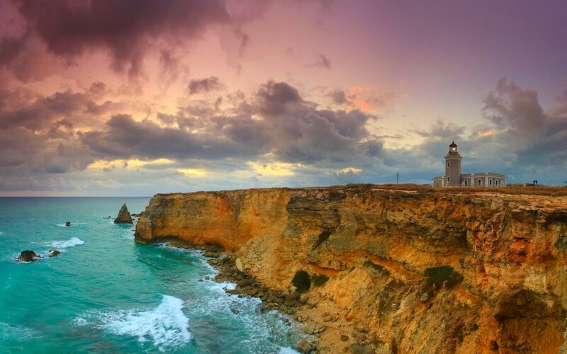 Lighthouse on Cliff — Purple, Dramatic, Sunset, Photograph, Ocean, Clouds