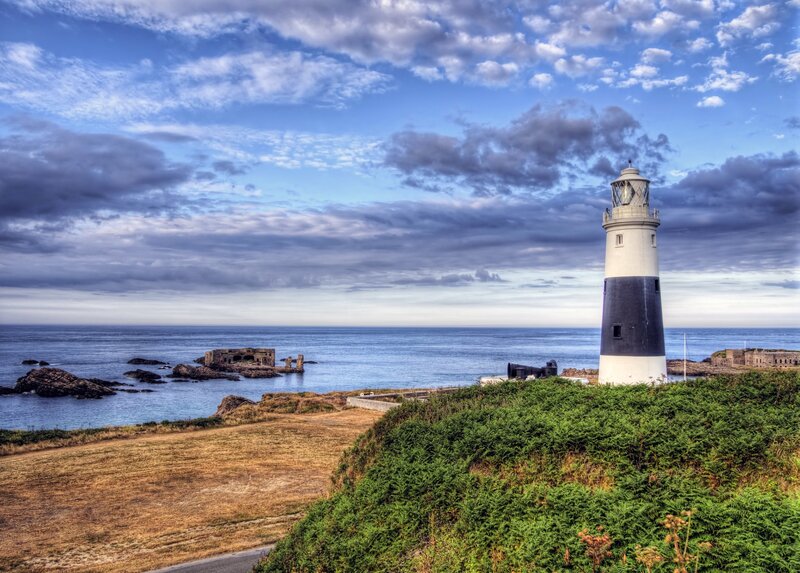 Lighthouse on Coastal Cliff — Blue, Dramatic, Afternoon, Photograph, Ocean