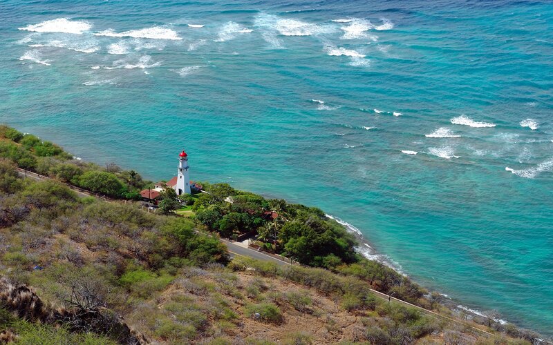Lighthouse on Coastal Cliff — Blue, Serene, Afternoon, Photograph, Ocean, Road