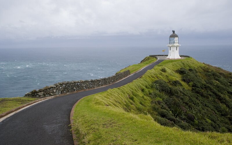Lighthouse on Coastal Cliff — Green, Overcast