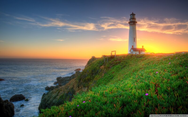Lighthouse on Coastal Cliff — Green, Serene, Sunset