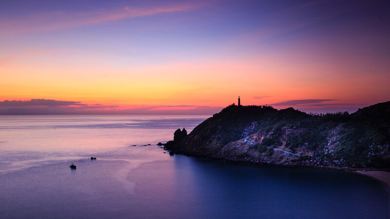 Lighthouse on Coastal Cliff — Purple, Serene, Sunset, Photograph, Ocean, Sky