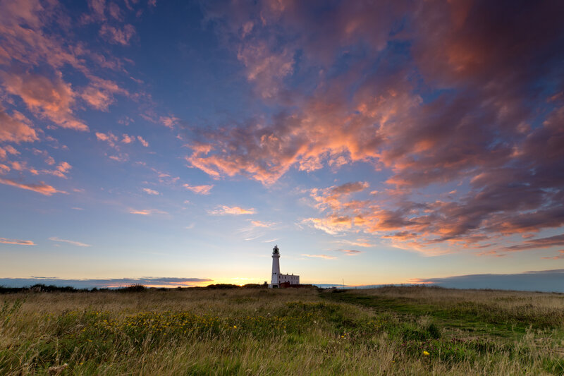 Lighthouse on Coastal Hill — Blue, Serene, Sunrise