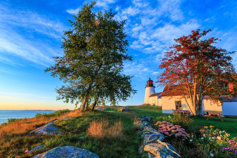 Lighthouse on Coastal Hill — Blue, Serene, Sunset, Photograph