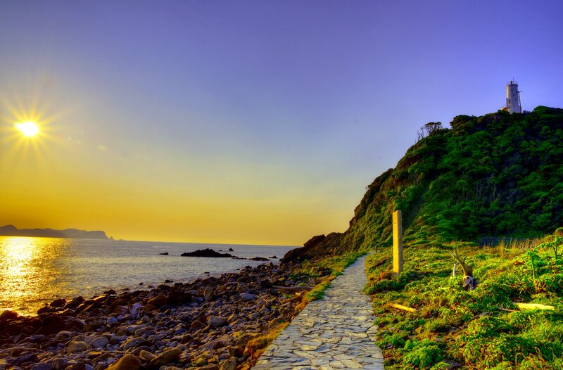 Lighthouse on Coastal Hill — Blue, Serene, Sunset
