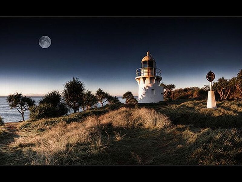 Lighthouse on Coastal Hill — Blue, Serene