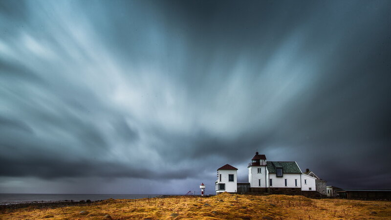 Lighthouse on Coastal Hill — Gray, Dramatic