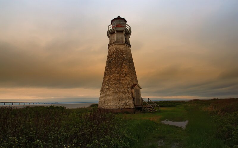 Lighthouse on Coastal Land — Gray