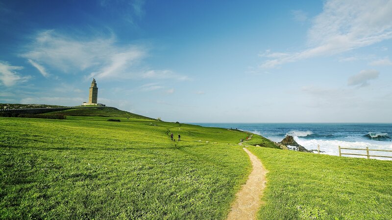 Lighthouse on Grassy Cliff