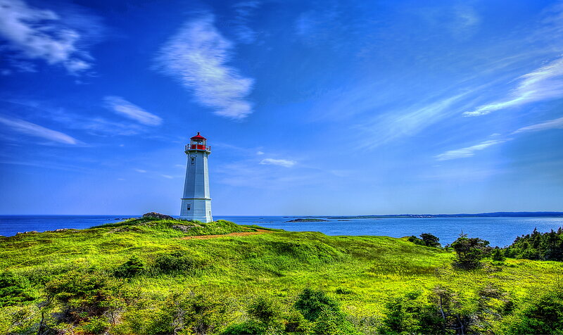 Lighthouse on Grassy Hill — Blue, Serene, Afternoon
