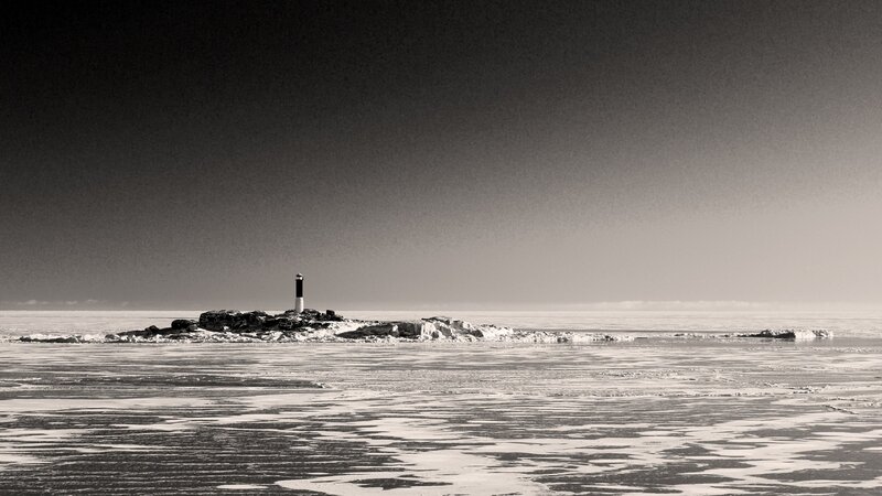 Lighthouse on icy shore