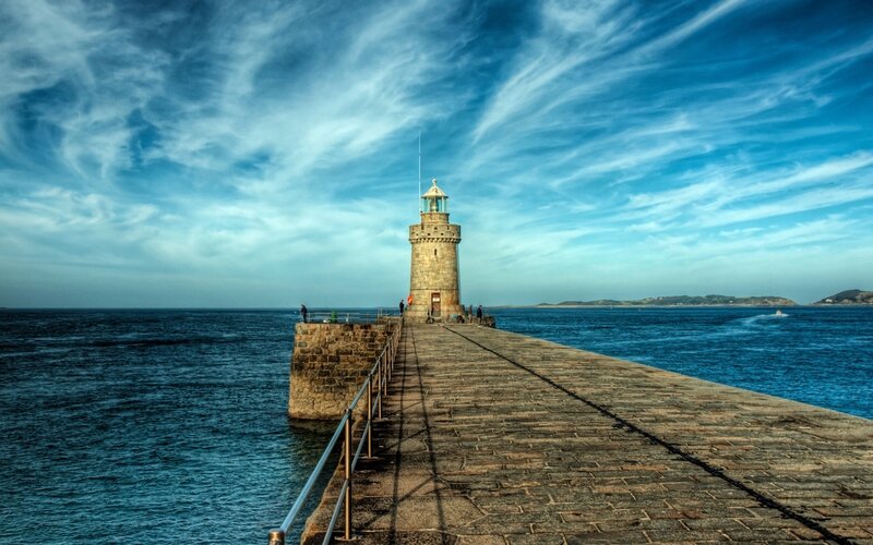 Lighthouse on Pier — Blue, Serene, Afternoon, Photograph, Ocean, Sky, People