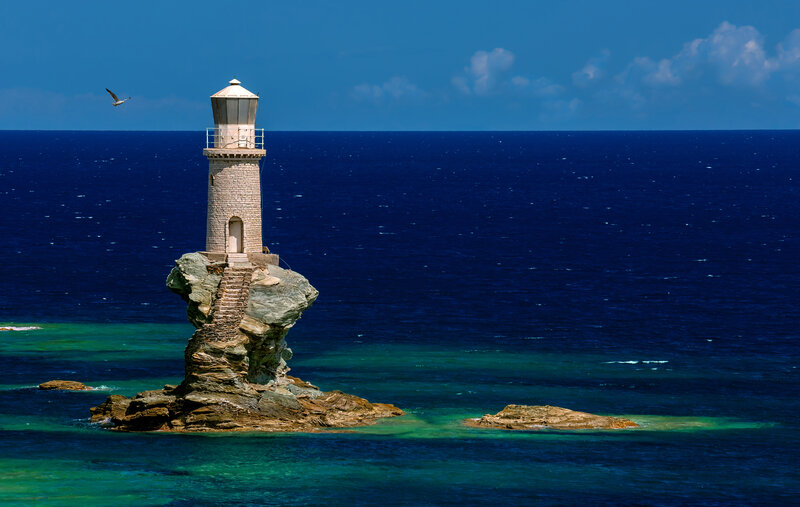 Lighthouse on Rock Formation — Blue, Serene