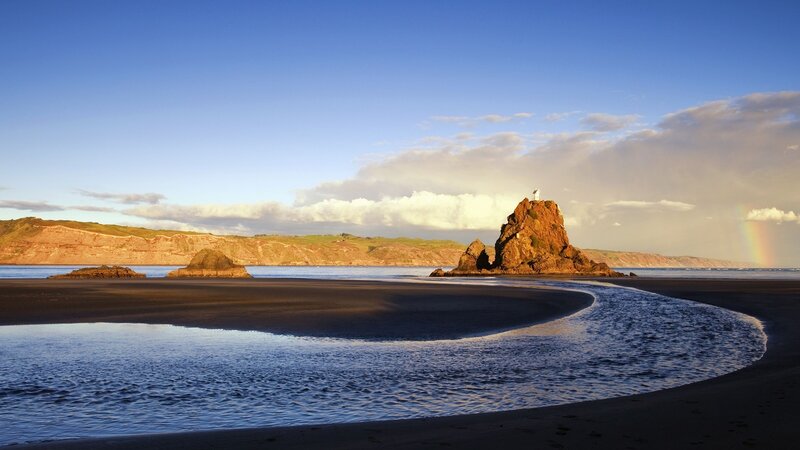 Lighthouse on Rock Formation — Blue