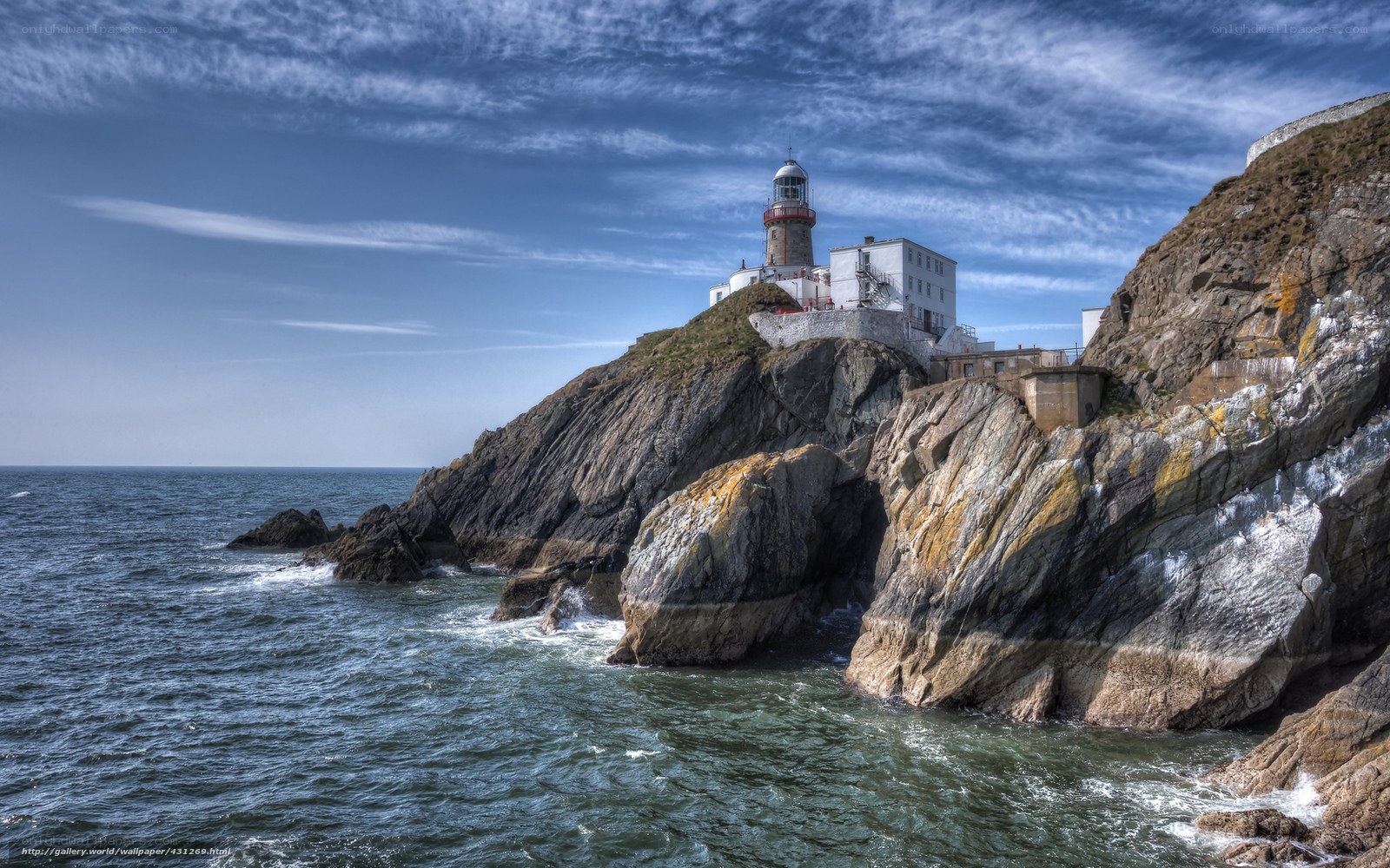 Lighthouse on rocky cliff