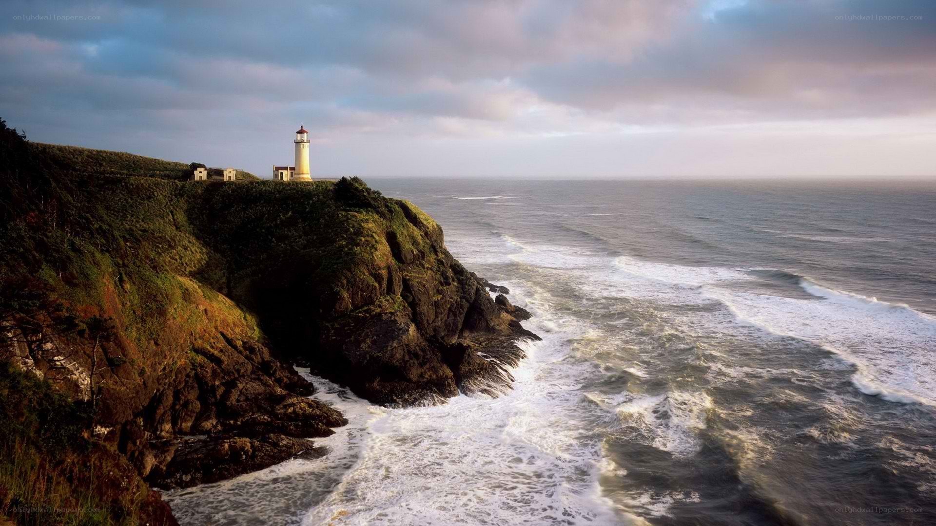 lighthouse on rocky cliff
