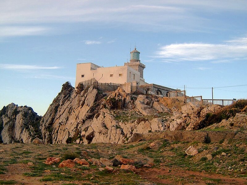 lighthouse on rocky cliff