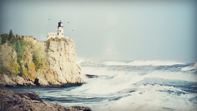 Lighthouse on Rocky Cliff — Blue, Dramatic, Afternoon, Photograph