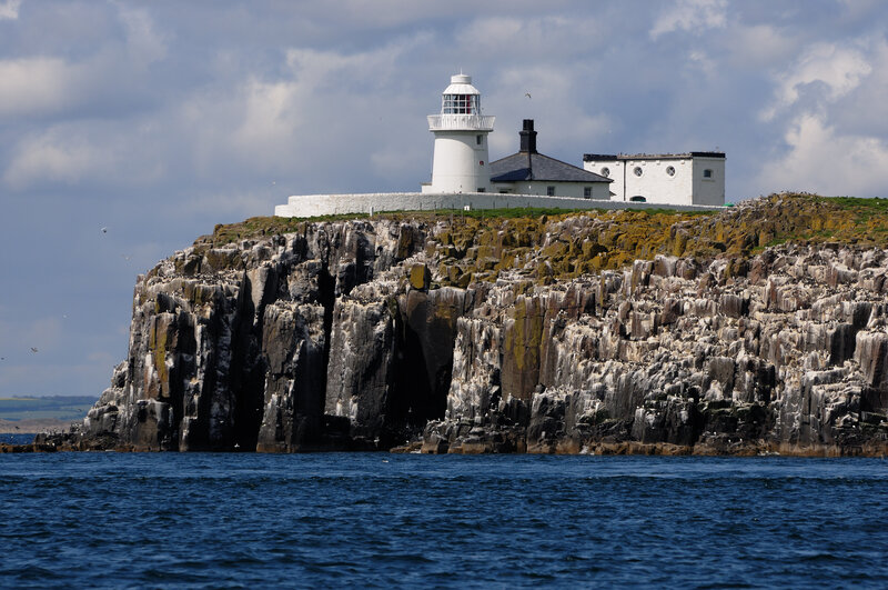 Lighthouse on Rocky Cliff — Blue, Dramatic, Afternoon