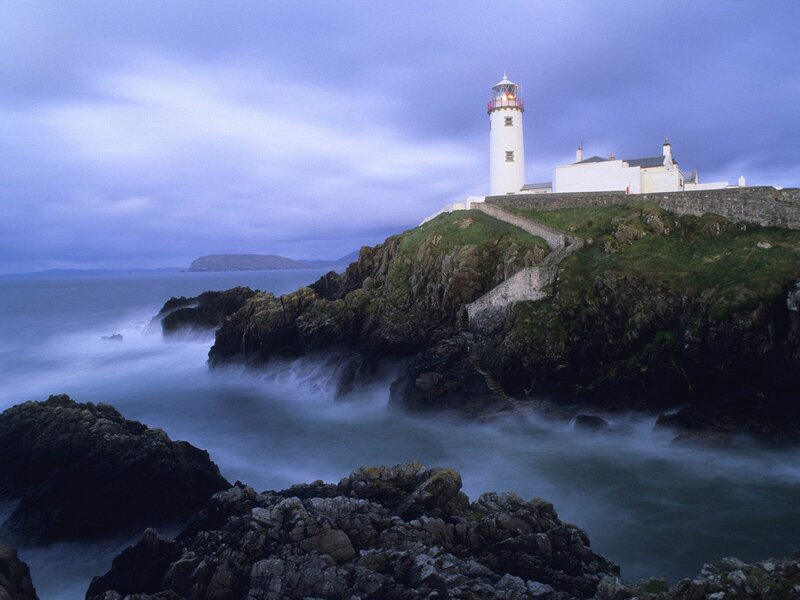 Lighthouse on Rocky Cliff — Blue, Dramatic, Night, Photograph