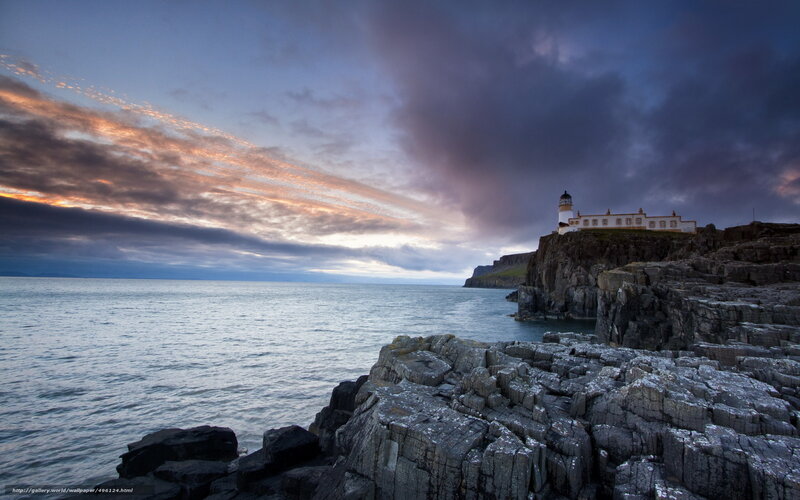 Lighthouse on Rocky Cliff — Blue, Dramatic, Sunset, Photograph, Ocean, Clouds, Cliffs