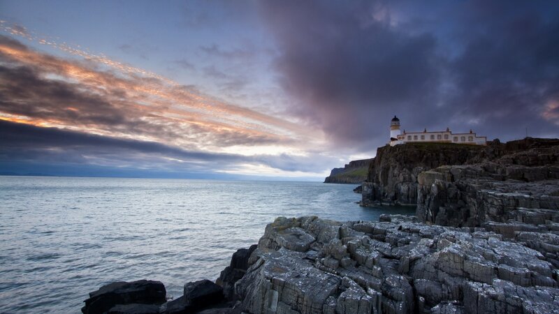 Lighthouse on Rocky Cliff — Blue, Dramatic, Sunset, Photograph, Ocean, Sky, Clouds