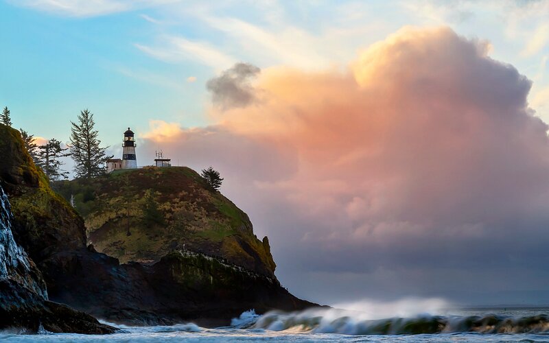 Lighthouse on Rocky Cliff — Blue, Dramatic, Sunset, Photograph, Ocean, Waves, Clouds