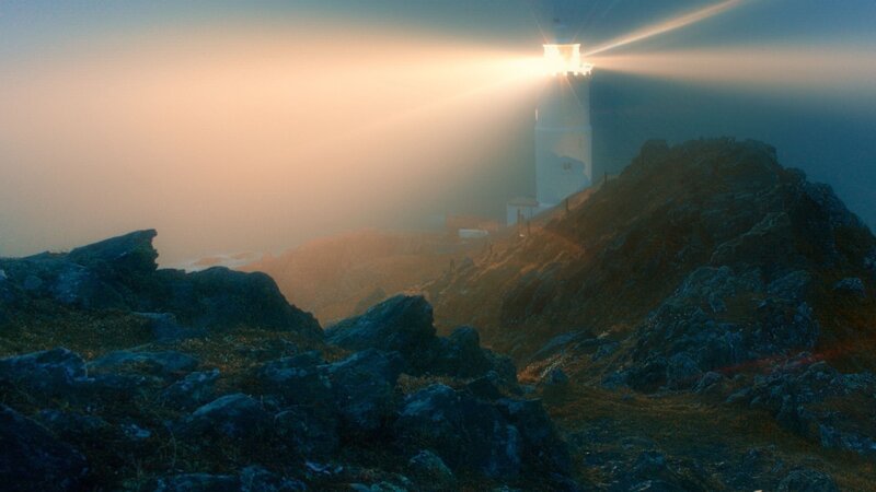 Lighthouse on Rocky Cliff — Blue, Dramatic, Sunset, Photograph, Sea