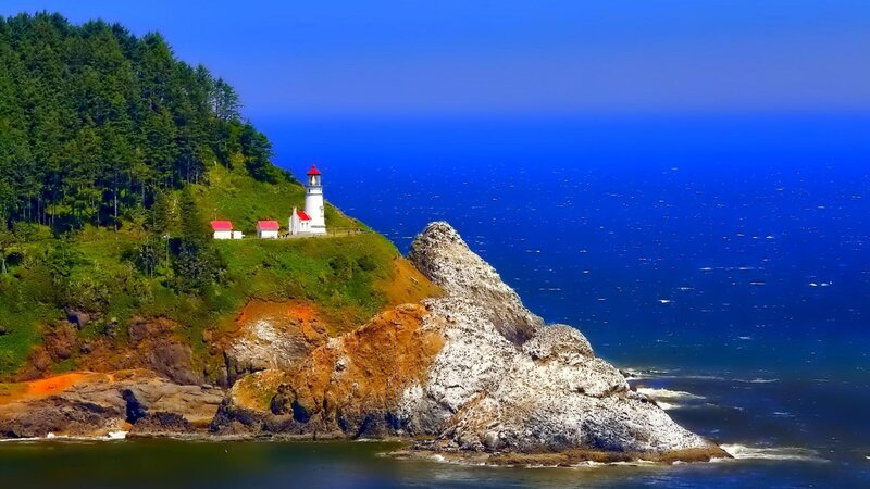 Lighthouse on Rocky Cliff — Blue, Serene, Afternoon, Photograph, Ocean, Trees, Rocks