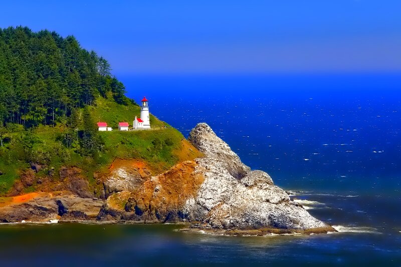 Lighthouse on Rocky Cliff — Blue, Serene, Afternoon, Photograph, Ocean, Trees