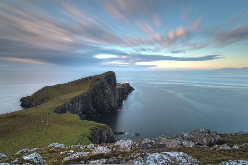 Lighthouse on Rocky Cliff — Blue, Serene, Sunset, Photograph, Ocean, Sky, Path