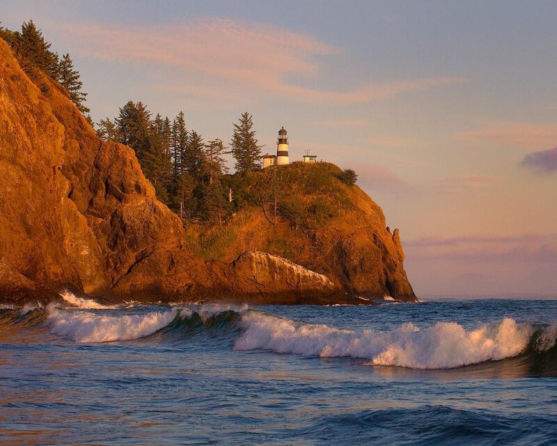 Lighthouse on Rocky Cliff — Blue, Serene, Sunset, Photograph