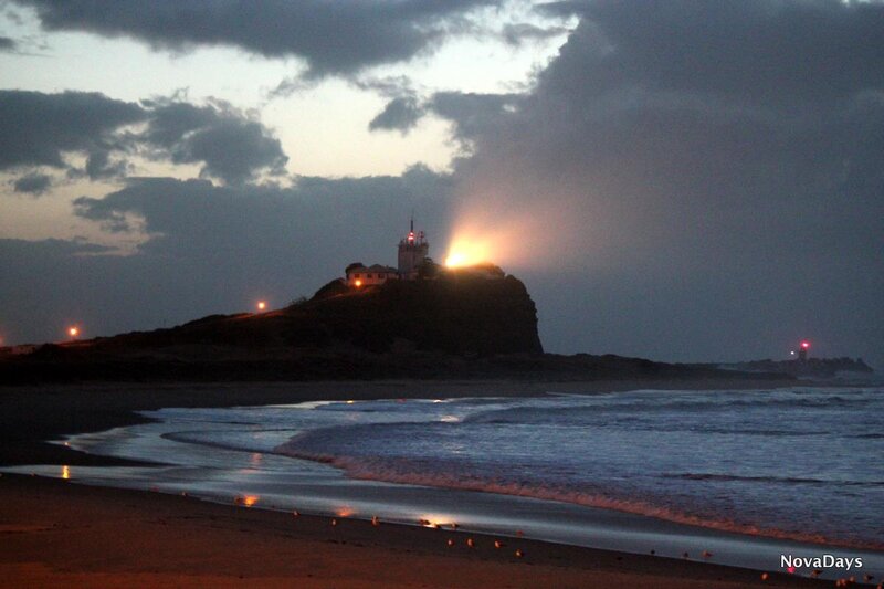 Lighthouse on Rocky Cliff — Dark Blue, Dramatic
