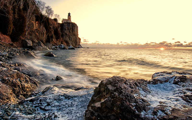 Lighthouse on Rocky Cliff — Gold, Serene, Sunset