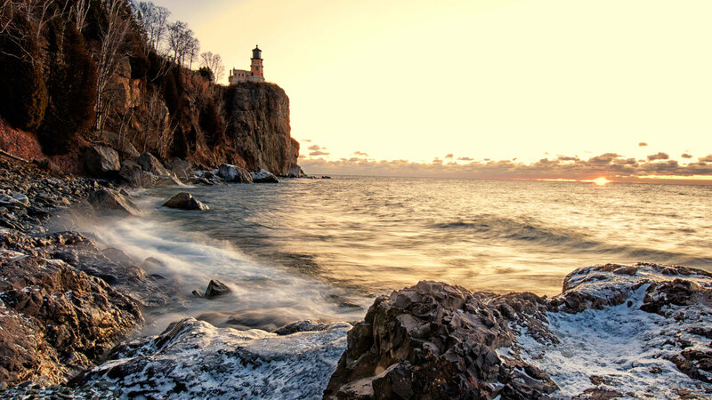 Lighthouse on Rocky Cliff — Gold, Serene