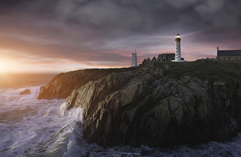 Lighthouse on Rocky Cliff — Gray, Dramatic, Sunset