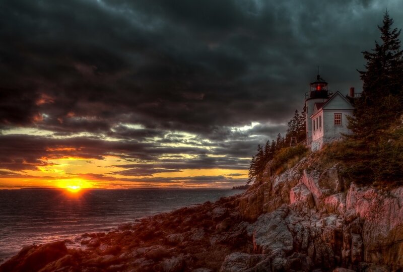 Lighthouse on Rocky Cliff — Orange, Dramatic, Sunset, Photograph