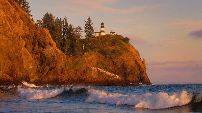 Lighthouse on Rocky Cliff — Orange, Serene, Sunset