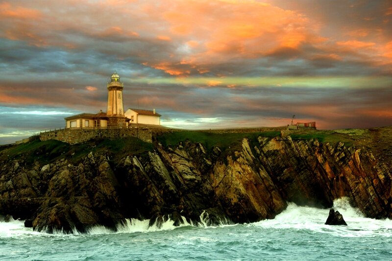 Lighthouse on Rocky Cliff — Orange