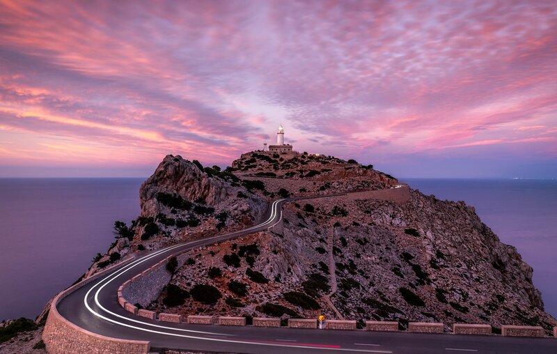 Lighthouse on Rocky Cliff — Pink, Dramatic