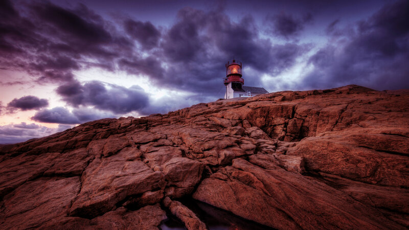 Lighthouse on Rocky Cliff — Purple, Dramatic, Sunset, Photograph, Clouds, Rock